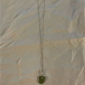 Green stone pendant on silver chain with pearl, 18”.